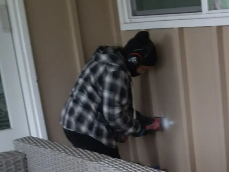 Professional electrician installing an exterior outlet in Brown Station
